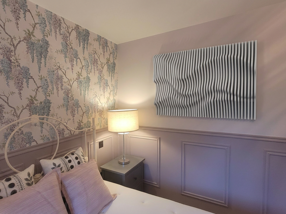 Pale wave panel on a panelled wall above a bed, beside toile wallpaper